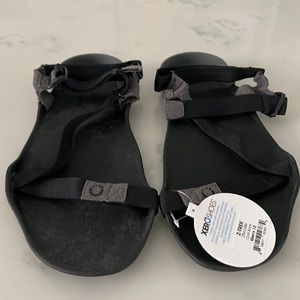 Size 12 xero minimal sole sandals in black. New with tags.